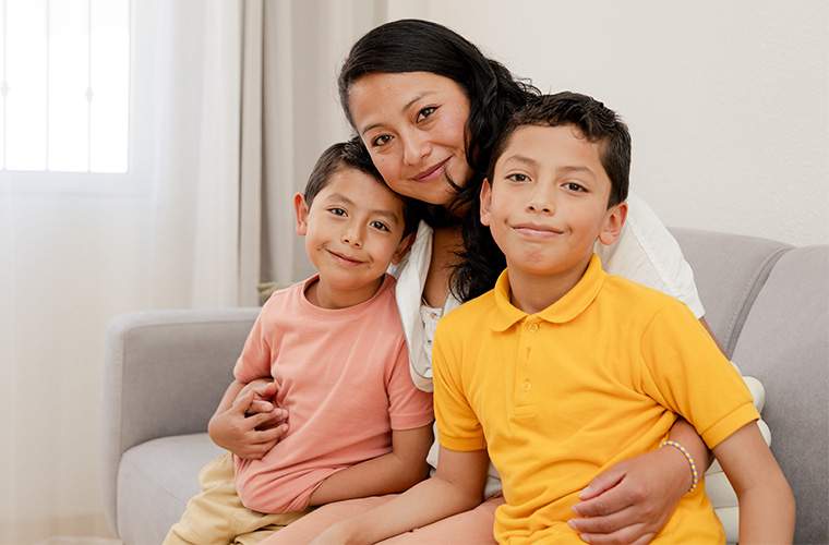 Adult and Pediatric Physical Exams- a mother embraces her two sons