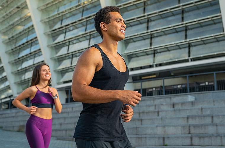 Sports Physicals - happy healthy couple joggind